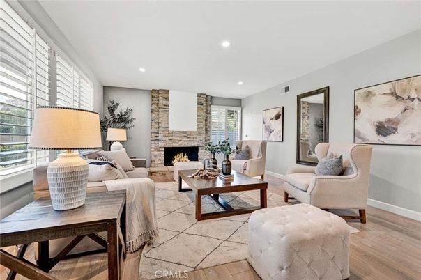 Fireplace, Interior, Living room, Recessed Lighting, Stone Walls, Wood Texture Flooring
