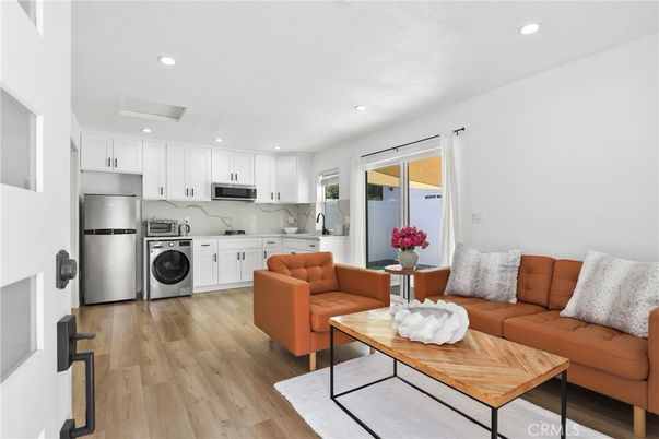 Interior, Kitchen, Living room, Marble Walls, Recessed Lighting, Stainless Steel Appliances, Wood Texture Flooring
