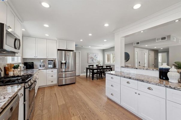 Dining room, Interior, Kitchen, Recessed Lighting, Stainless Steel Appliances, Wood Texture Flooring