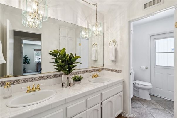 Bathroom, Chandelier, Dual Sink Vanities, Interior, Tile Countertops