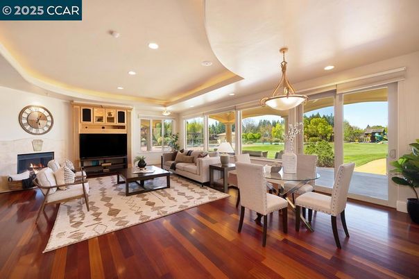Dining room, Fireplace, Interior, Living room, Pendant Lights, Recessed Lighting, Wood Texture Flooring