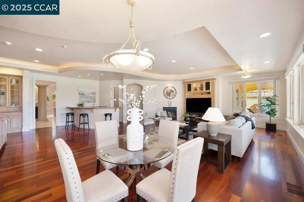 Dining room, Fireplace, Interior, Living room, Pendant Lights, Recessed Lighting, Wood Texture Flooring