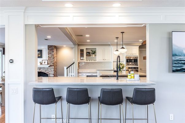 Interior, Kitchen, Pendant Lights, Recessed Lighting, Stainless Steel Appliances, Stone Walls, Wood Texture Flooring
