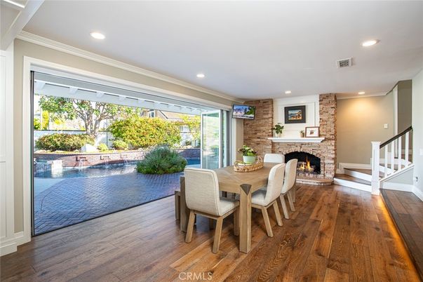 Dining room, Fireplace, Interior, Recessed Lighting, Stone Walls, Wood Texture Flooring
