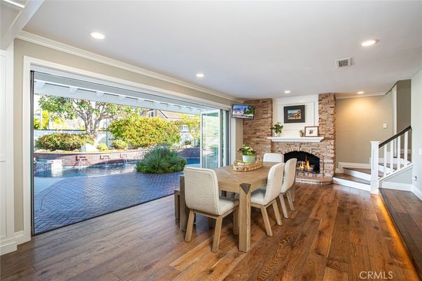 Dining room, Fireplace, Interior, Recessed Lighting, Stone Walls, Wood Texture Flooring