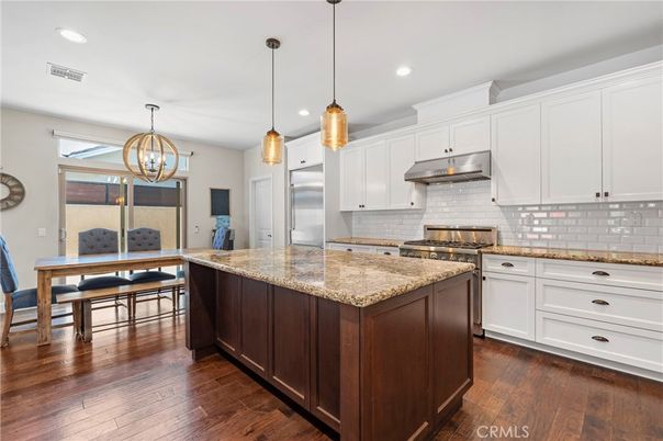 Dining room, Interior, Kitchen, Pendant Lights, Recessed Lighting, Stainless Steel Appliances, Wood Texture Flooring