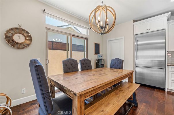 Chandelier, Dining room, Interior, Kitchen, Pendant Lights, Stainless Steel Appliances, Wood Texture Flooring