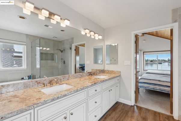 Bathroom, Bedroom, Dual Sink Vanities, Glass Shower, Interior, Water, Wood Texture Flooring