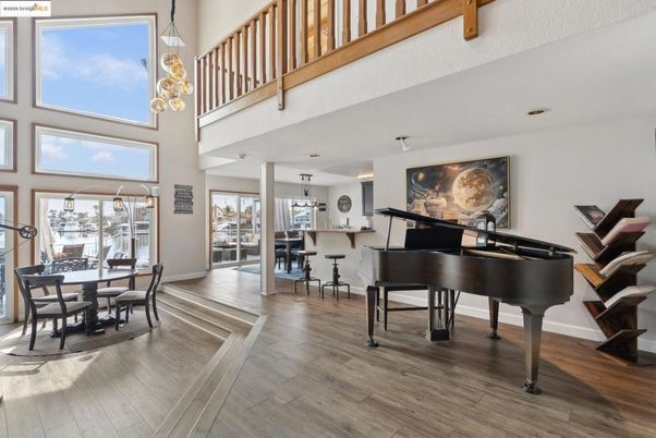 Dining room, Interior, Pendant Lights, Piano, Wood Texture Flooring