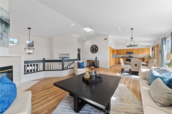 Dining room, Fireplace, Interior, Kitchen, Living room, Pendant Lights, Recessed Lighting, Stainless Steel Appliances, Wood Texture Flooring