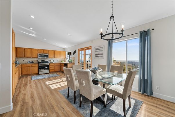 Chandelier, Dining room, Interior, Kitchen, Pendant Lights, Recessed Lighting, Stainless Steel Appliances, Wood Texture Flooring