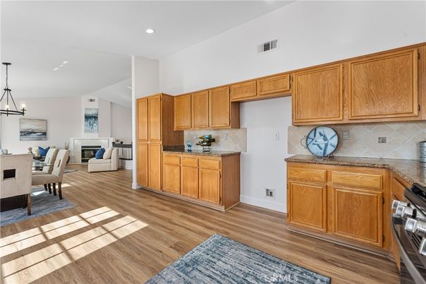 Chandelier, Dining room, Fireplace, Interior, Kitchen, Pendant Lights, Recessed Lighting, Wood Texture Flooring