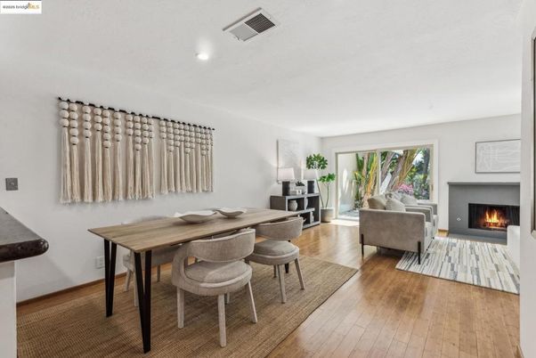 Dining room, Fireplace, Interior, Living room, Recessed Lighting, Wood Texture Flooring