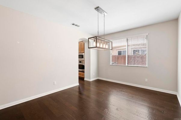 Empty room, Interior, Kitchen, Pendant Lights, Stainless Steel Appliances, Wood Texture Flooring