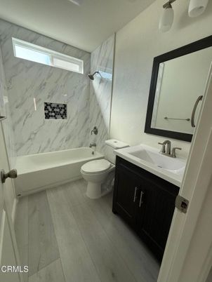Bathroom, Dual Sink Vanities, Interior, Marble Walls, Wood Texture Flooring