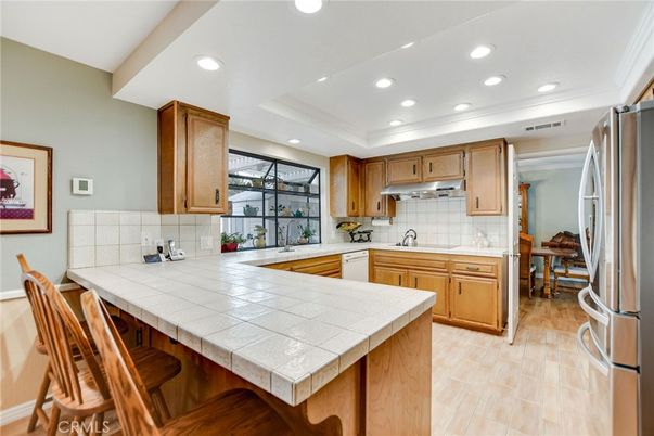Interior, Kitchen, Recessed Lighting, Tile Countertops, Wood Texture Flooring