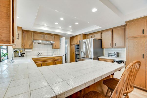 Interior, Kitchen, Recessed Lighting, Stainless Steel Appliances, Tile Countertops