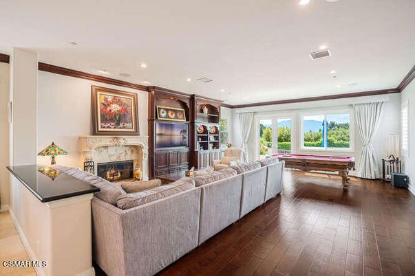 Billiard Table, Fireplace, Game Room, Interior, Living room, Recessed Lighting, Wood Texture Flooring