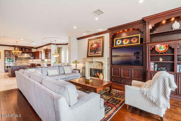 Chandelier, Fireplace, Interior, Kitchen, Living room, Pendant Lights, Recessed Lighting, Wood Texture Flooring