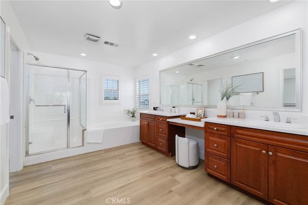 Bathroom, Dual Sink Vanities, Glass Shower, Interior, Recessed Lighting, Wood Texture Flooring
