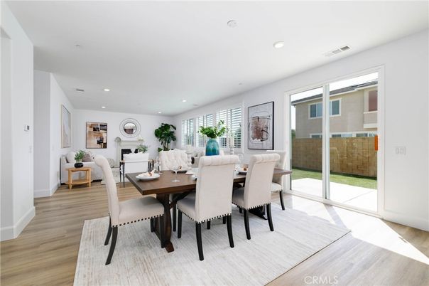 Dining room, Fireplace, Interior, Living room, Recessed Lighting, Wood Texture Flooring