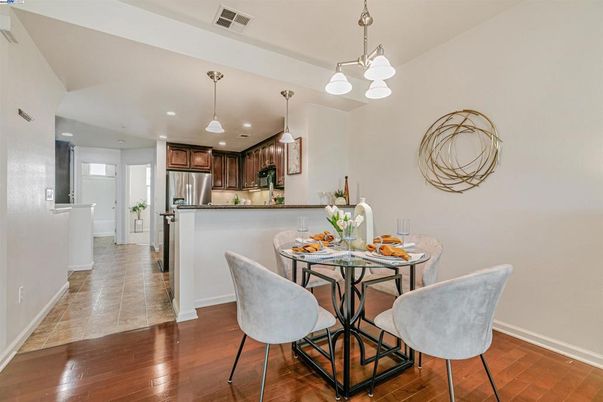 Dining room, Interior, Kitchen, Pendant Lights, Recessed Lighting, Stainless Steel Appliances, Wood Texture Flooring