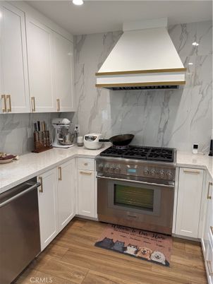Interior, Kitchen, Marble Walls, Recessed Lighting, Stainless Steel Appliances, Wood Texture Flooring