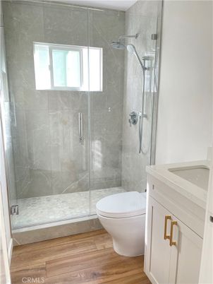 Bathroom, Glass Shower, Interior, Marble Walls, Wood Texture Flooring