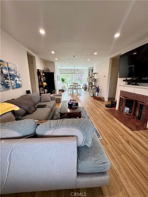 Dining room, Fireplace, Interior, Living room, Pendant Lights, Recessed Lighting, Wood Texture Flooring