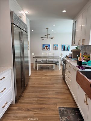 Dining room, Interior, Kitchen, Pendant Lights, Recessed Lighting, Stainless Steel Appliances, Wood Texture Flooring
