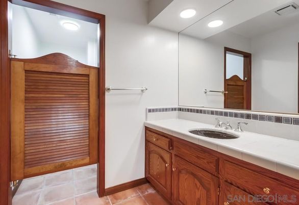 Bathroom, Dual Sink Vanities, Interior, Recessed Lighting, Tile Countertops