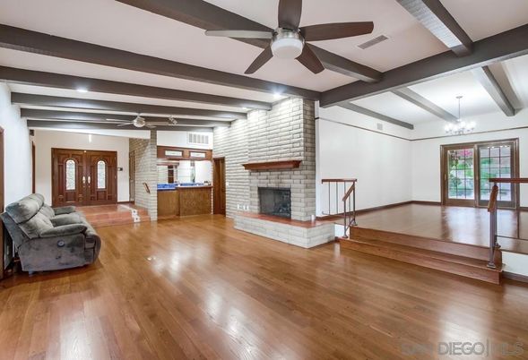 Chandelier, Empty room, Fireplace, Interior, Stone Walls, Wooden Beams, Wood Texture Flooring