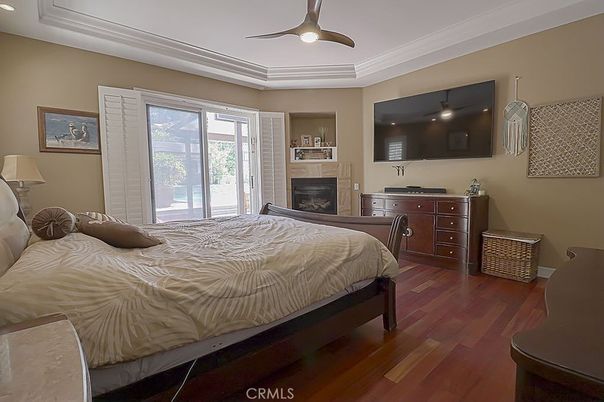 Bedroom, Fireplace, Interior, Recessed Lighting, Wood Texture Flooring