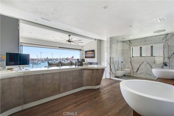 Bathroom, Free Standing Baths, Interior, Marble Walls, Recessed Lighting, Wood Texture Flooring