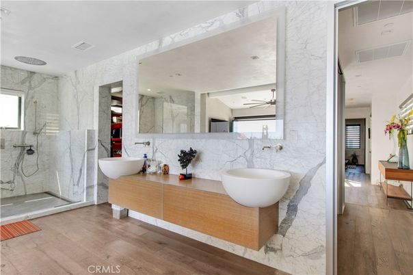 Bathroom, Dual Sink Vanities, Free Standing Baths, Glass Shower, Interior, Marble, Marble Walls, Recessed Lighting, Wood Texture Flooring