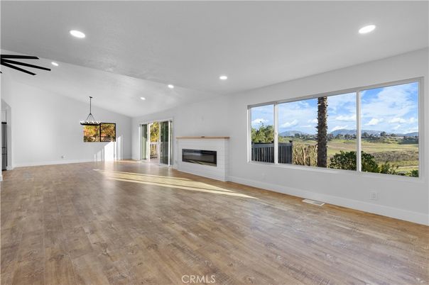 Empty room, Fireplace, Interior, Pendant Lights, Recessed Lighting, Wood Texture Flooring