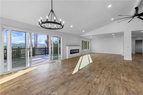 Chandelier, Empty room, Fireplace, Interior, Recessed Lighting, Wood Texture Flooring