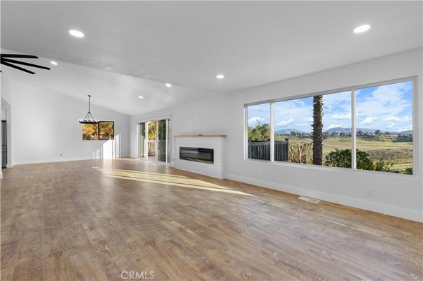 Empty room, Fireplace, Interior, Pendant Lights, Recessed Lighting, Wood Texture Flooring