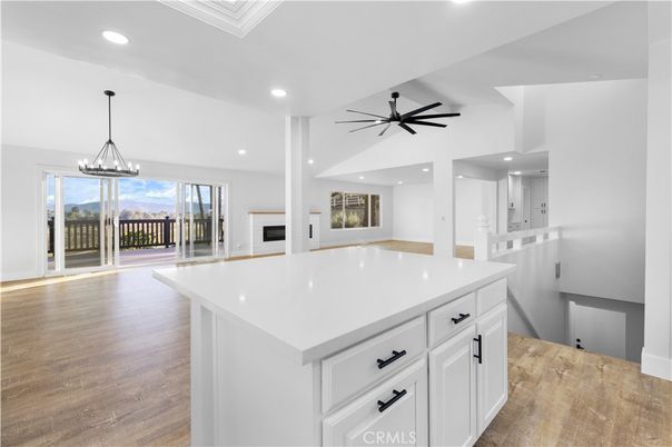 Empty room, Fireplace, Interior, Kitchen, Pendant Lights, Recessed Lighting, Wood Texture Flooring