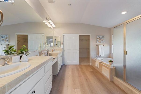Bathroom, Dual Sink Vanities, Glass Shower, Interior, Recessed Lighting, Wood Texture Flooring