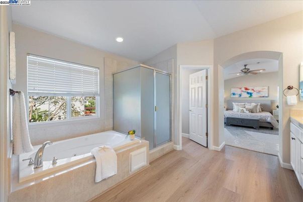 Bathroom, Bedroom, Glass Shower, Interior, Recessed Lighting, Wood Texture Flooring