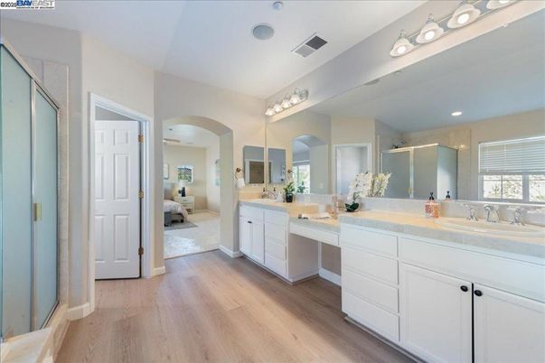 Bathroom, Dual Sink Vanities, Interior, Recessed Lighting, Wood Texture Flooring