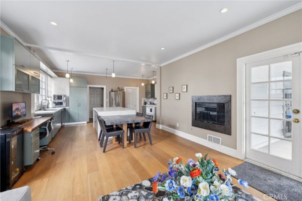 Dining room, Fireplace, Interior, Kitchen, Pendant Lights, Recessed Lighting, Stainless Steel Appliances, Wood Texture Flooring