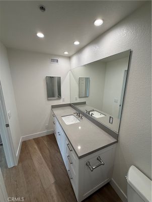 Bathroom, Dual Sink Vanities, Interior, Recessed Lighting, Wood Texture Flooring