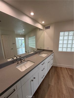 Bathroom, Dual Sink Vanities, Interior, Recessed Lighting, Wood Texture Flooring