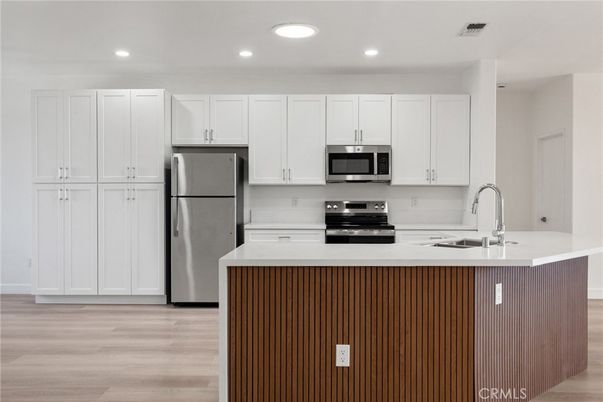Interior, Kitchen, Recessed Lighting, Stainless Steel Appliances, Wood Texture Flooring