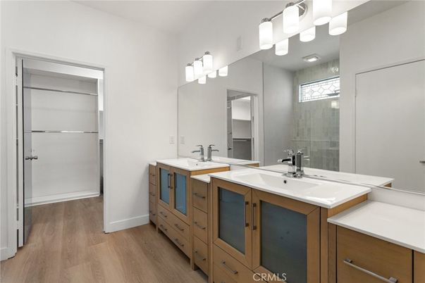 Bathroom, Dual Sink Vanities, Glass Shower, Interior, Wood Texture Flooring