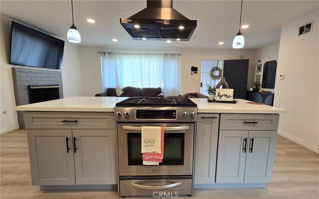 Fireplace, Interior, Kitchen, Pendant Lights, Recessed Lighting, Stainless Steel Appliances, Wood Texture Flooring