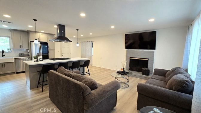 Fireplace, Interior, Kitchen, Living room, Pendant Lights, Recessed Lighting, Stainless Steel Appliances, Wood Texture Flooring