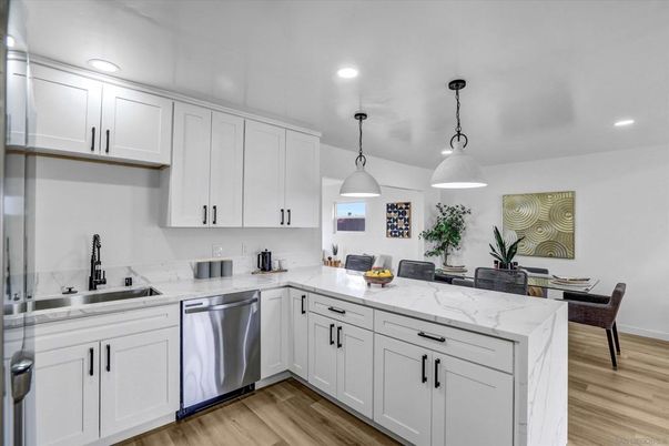 Dining room, Interior, Kitchen, Pendant Lights, Recessed Lighting, Stainless Steel Appliances, Wood Texture Flooring
